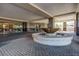 An elegant building entrance featuring a decorative fountain and brick-paved driveway at 2211 E Camelback Rd # 601, Phoenix, AZ 85016