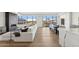 Bright living room featuring a linear fireplace, hardwood floors and expansive windows with cityscape views at 2211 E Camelback Rd # 601, Phoenix, AZ 85016