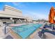 Stylish rooftop pool area featuring clear blue water, lounge seating, and stunning city views at 2211 E Camelback Rd # 601, Phoenix, AZ 85016