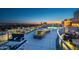 Upscale rooftop deck showcasing a pool, hot tub, dining area and comfortable lounge chairs at 2211 E Camelback Rd # 601, Phoenix, AZ 85016