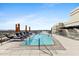 Gorgeous rooftop pool with lounge chairs and umbrellas, offering a luxurious urban retreat at 2211 E Camelback Rd # 601, Phoenix, AZ 85016