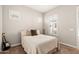 Cozy bedroom featuring neutral tones, window shutters, and an electric guitar, creating a relaxed atmosphere at 22426 N 29Th Pl, Phoenix, AZ 85050