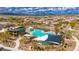 Aerial view of a community pool with seating and landscaping, nestled in a residential neighborhood at 22426 N 29Th Pl, Phoenix, AZ 85050