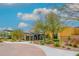 This community clubhouse boasts desert landscaping, a covered entryway, and abundant natural light from the large windows at 22426 N 29Th Pl, Phoenix, AZ 85050