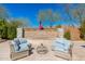 Inviting outdoor space highlights a cozy gas fire pit and comfortable seating for relaxing and entertaining at 22426 N 29Th Pl, Phoenix, AZ 85050