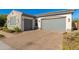 Home's garages boast a brick driveway, landscaped yard, and stone architectural detail at 22426 N 29Th Pl, Phoenix, AZ 85050