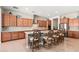 Spacious kitchen featuring custom cabinetry, a large island with seating, and stylish backsplash at 22426 N 29Th Pl, Phoenix, AZ 85050