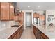 Bright kitchen with stainless steel appliances, granite countertops, gas range and decorative backsplash at 22426 N 29Th Pl, Phoenix, AZ 85050