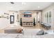 Cozy living room with stylish furnishings, a feature wall with TV, and access to other areas of the home at 22426 N 29Th Pl, Phoenix, AZ 85050