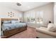 Bright and airy bedroom with plantation shutters and ceiling fan at 22426 N 29Th Pl, Phoenix, AZ 85050