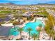 Resort-style pool featuring ample seating, sun shades, palm trees, and a clubhouse with mountain views at 22426 N 29Th Pl, Phoenix, AZ 85050