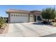 Charming single-story home with a spacious three-car garage and desert landscaping at 3025 S Copperwood --, Mesa, AZ 85212