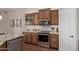 Kitchen featuring stainless steel oven, granite countertops, and wooden cabinetry at 3025 S Copperwood --, Mesa, AZ 85212