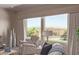 Comfortable living room featuring large windows with scenic outdoor views at 3025 S Copperwood --, Mesa, AZ 85212