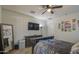 Spacious bedroom featuring neutral carpet, ceiling fan, and mounted television at 30945 W Picadilly Rd, Buckeye, AZ 85396