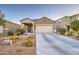 Attractive home with desert landscaping and a spacious two-car garage at 30945 W Picadilly Rd, Buckeye, AZ 85396