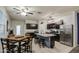 Bright kitchen featuring stainless steel appliances, dark cabinetry, a large center island, and a breakfast nook at 30945 W Picadilly Rd, Buckeye, AZ 85396