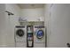 Well-equipped laundry room with modern washer and dryer units at 30945 W Picadilly Rd, Buckeye, AZ 85396