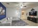 Comfortable living room features modern furniture, ceiling fan, and cozy ambiance at 30945 W Picadilly Rd, Buckeye, AZ 85396