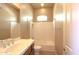 Cozy bathroom with a vanity, sink, medicine cabinet, and a shower-tub combination at 31483 N 133Rd Dr, Peoria, AZ 85383