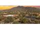 Expansive aerial view of a desert community nestled among the native vegetation at 35345 N Canyon Creek Ct, Carefree, AZ 85377