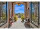 Charming entryway with brick archway and a decorative fountain visible beyond at 35345 N Canyon Creek Ct, Carefree, AZ 85377