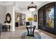 Gracious foyer with decorative table, chandelier, and designer front door at 35345 N Canyon Creek Ct, Carefree, AZ 85377