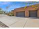 Three car garage and large concrete driveway at 35345 N Canyon Creek Ct, Carefree, AZ 85377