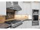 Kitchen detail showcases modern appliances and tile backsplash at 35345 N Canyon Creek Ct, Carefree, AZ 85377