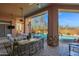 Covered patio with a pool and desert landscape views at 35345 N Canyon Creek Ct, Carefree, AZ 85377