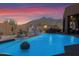 Inviting pool with water feature set against the backdrop of a desert mountain at 35345 N Canyon Creek Ct, Carefree, AZ 85377