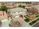 Bird's eye view of a stucco home with a tile roof, well-kept landscaping, and an attached garage at 3744 E Sierra Madre Ave, Gilbert, AZ 85296