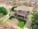 Aerial view of the home with a well-maintained lawn, landscaping, and a tree lined neighborhood at 3744 E Sierra Madre Ave, Gilbert, AZ 85296