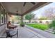 Covered patio with a ceiling fan offering a relaxing outdoor space overlooking the manicured backyard at 3744 E Sierra Madre Ave, Gilbert, AZ 85296