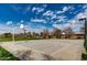 Community basketball court featuring well-maintained pavement, hoops, and surrounding landscaping at 3744 E Sierra Madre Ave, Gilbert, AZ 85296