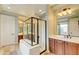 Modern bathroom featuring a glass-enclosed shower, dual vanities, and elegant fixtures at 3744 E Sierra Madre Ave, Gilbert, AZ 85296