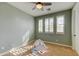 Inviting bedroom with a neutral color scheme, carpet, and large windows providing ample natural light at 3744 E Sierra Madre Ave, Gilbert, AZ 85296