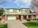 Charming two-story home with a well-manicured lawn, a stone facade and a brick driveway at 3744 E Sierra Madre Ave, Gilbert, AZ 85296