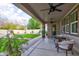 Covered patio with ceiling fans and outdoor seating, offering a comfortable extension of the home at 3744 E Sierra Madre Ave, Gilbert, AZ 85296