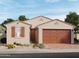 Charming single-story home with desert landscaping, shutters, and an attached two-car garage at 3823 S 87Th Dr, Tolleson, AZ 85353