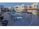 Community pool and spa with outdoor kitchen and seating area for relaxing in the sun at 4120 N 78Th St # 217, Scottsdale, AZ 85251