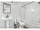 Bright bathroom featuring a shower-tub combo and pedestal sink at 4186 E Jasper Dr, Gilbert, AZ 85296