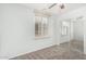 Bright bedroom with neutral carpet, ceiling fan, window and closet at 4186 E Jasper Dr, Gilbert, AZ 85296