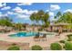 Inviting community pool with lounge chairs and lush landscaping for relaxation at 4186 E Jasper Dr, Gilbert, AZ 85296