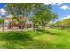 Community playground on a green lawn and covered picnic area at 4186 E Jasper Dr, Gilbert, AZ 85296