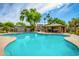 Community pool with a cabana and beautiful landscaping, perfect for relaxing and enjoying the outdoors at 4186 E Jasper Dr, Gilbert, AZ 85296