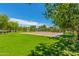 Sand volleyball court set in a grassy common area, great for outdoor recreation at 4186 E Jasper Dr, Gilbert, AZ 85296