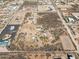 Aerial view of vast desert property featuring multiple homes and horse facilities at 43228 N 14Th St, New River, AZ 85087