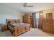 Bedroom featuring a wooden bed and dresser with a carpeted floor at 43228 N 14Th St, New River, AZ 85087