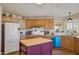 Charming eat-in kitchen with an island, custom cabinets, and modern appliances at 43228 N 14Th St, New River, AZ 85087